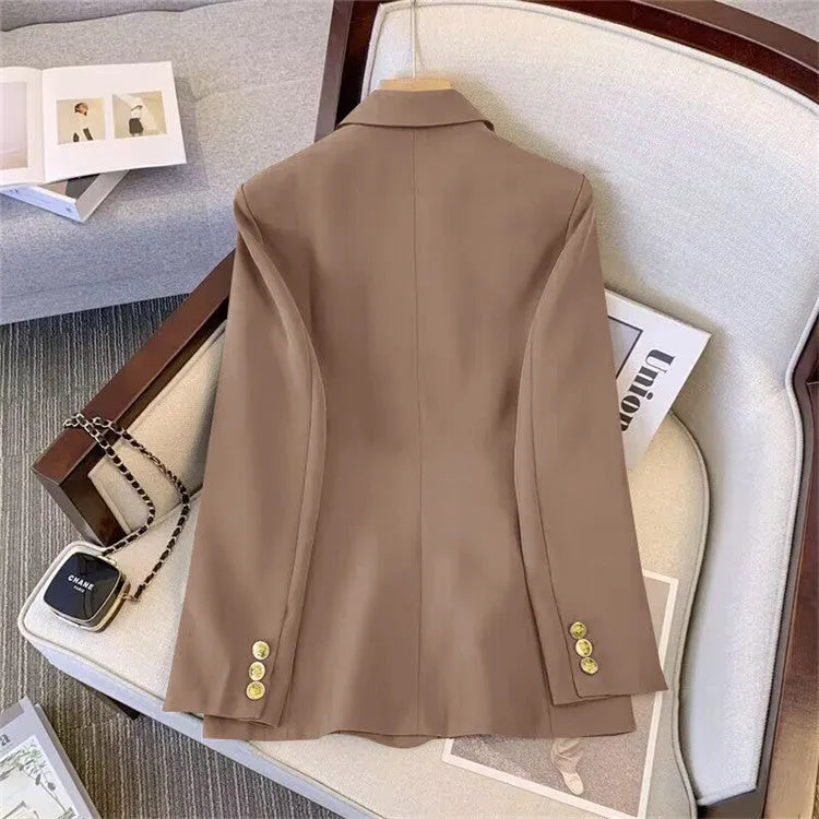 Women's loose-fit long sleeve polyester blouse in black, shown in a professional setting.
