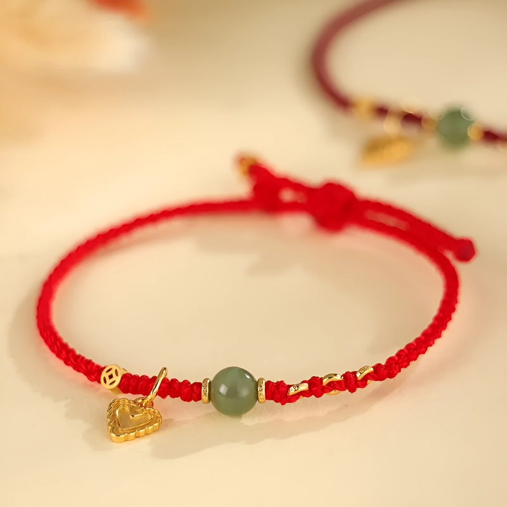 Handmade 925 silver bracelet with Hetian jade stone in woven design, available in red or dark red strap options