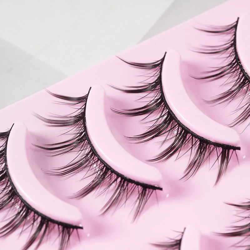 Pack of black manga style false eyelashes with natural wispy length for Korean makeup and cosplay.