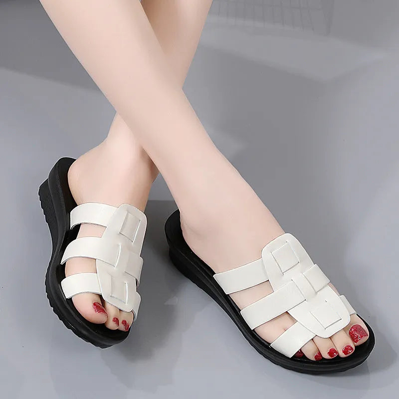 Beige women's flat bottom slippers with viscose upper and PU leather sole.