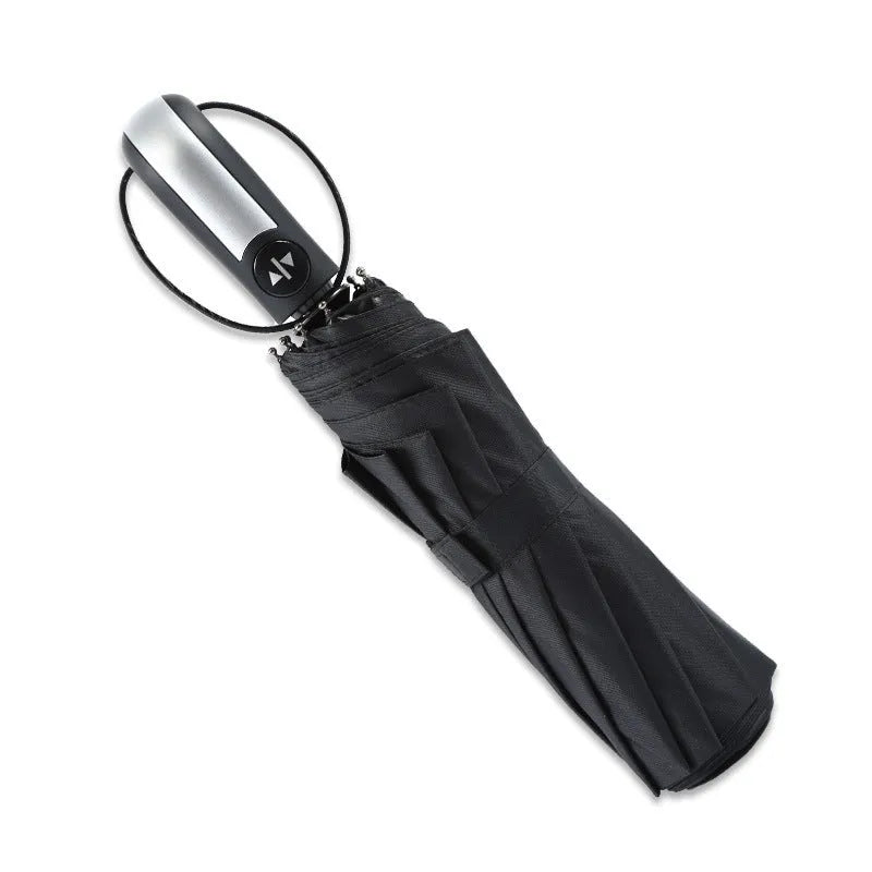Automatic open triple-fold large sun shade umbrella in black with a rubber handle.