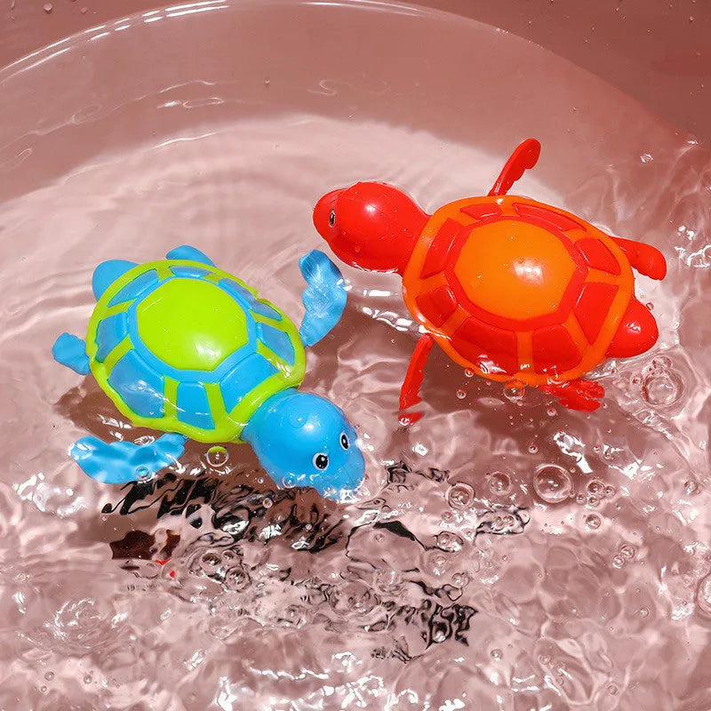 Plastic swimming turtle bath toy with brain game element for water play