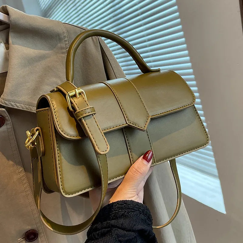 Women's beige messenger bag showing file compartment and sandwich pocket exterior