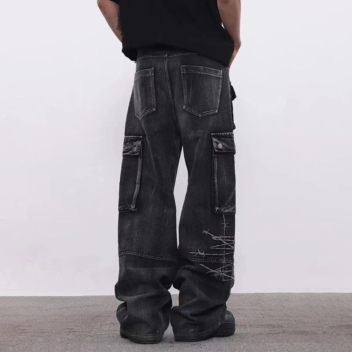 Men's black cotton wide-leg trousers with embroidery detailing and mid waist design