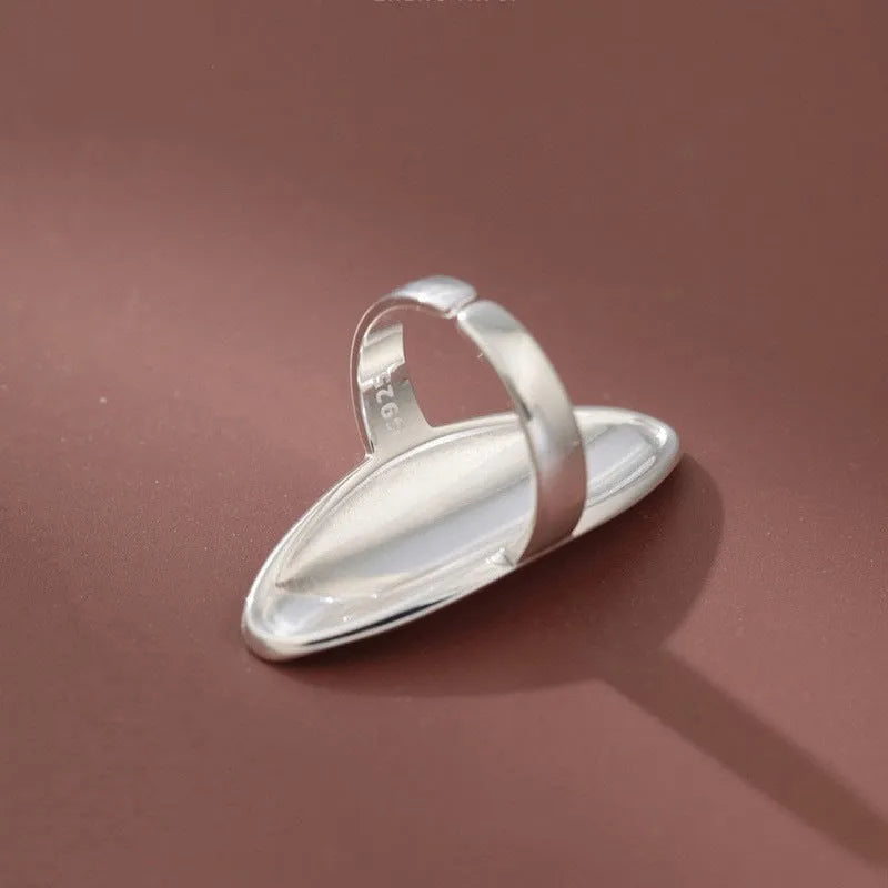 Geometric open ring for women in glossy electroplated silver tone on copper, adjustable band