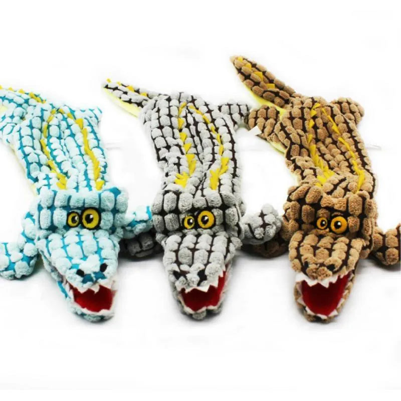 Blue corduroy crocodile-shaped squeaky dog toy shown next to size measurement