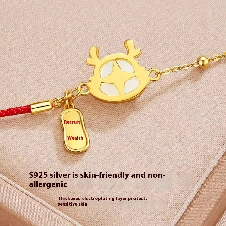 Silver-plated dragon zodiac bracelet with Hetian jade elements for women, showing electroplated finish and animal motif.