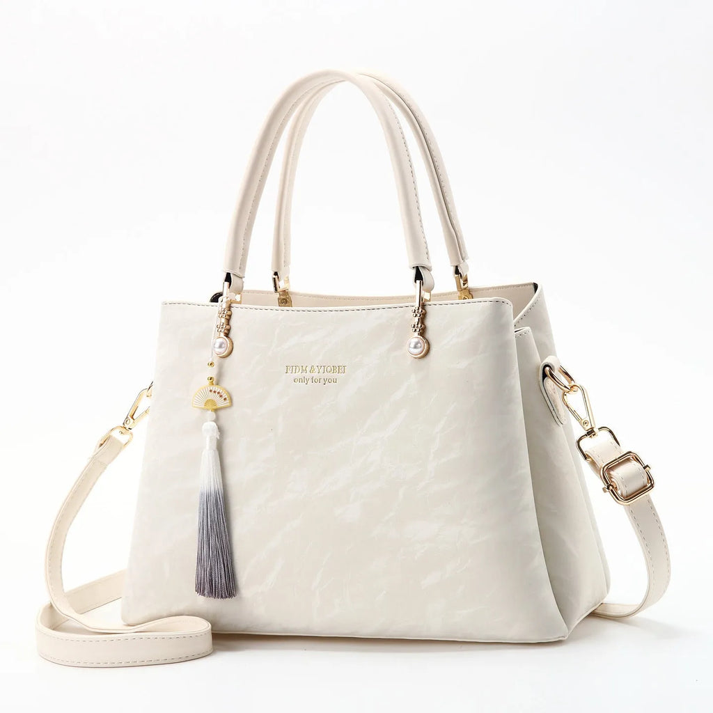 Women's large square shoulder bag in PU leather with a slit pocket, shown in beige colour.