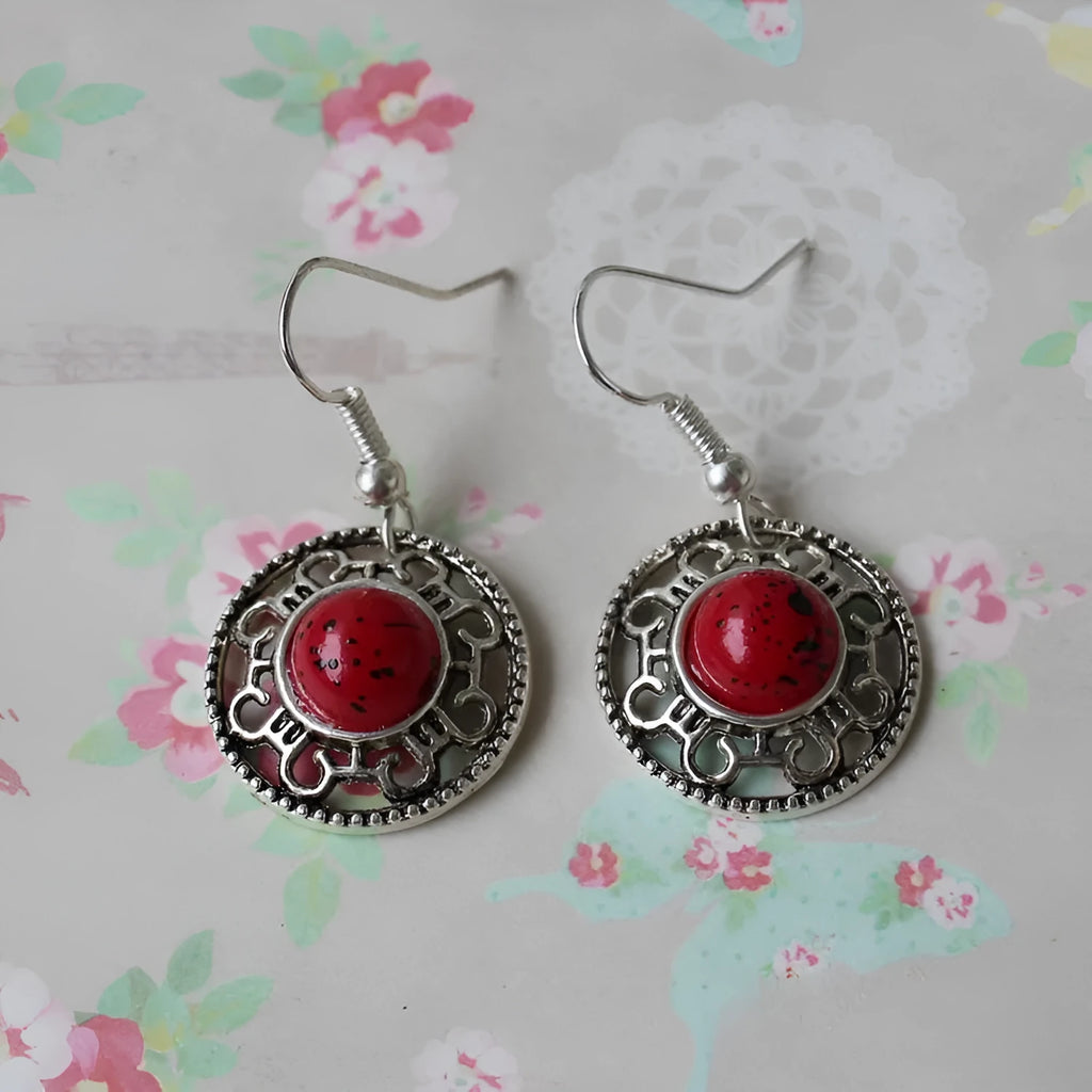Handmade Miao silver geometric flower disk earrings with turquoise stone in black, blue, or red.