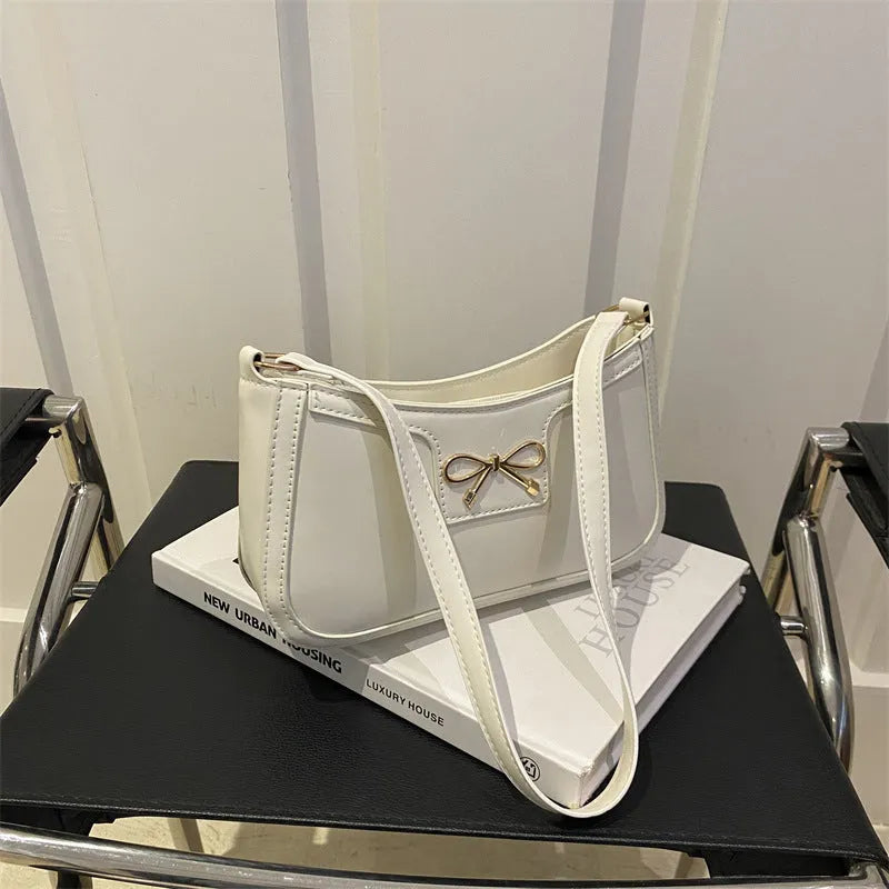 Western-style shoulder bag with bow decoration in multiple colours showing 24x14x5cm dimensions