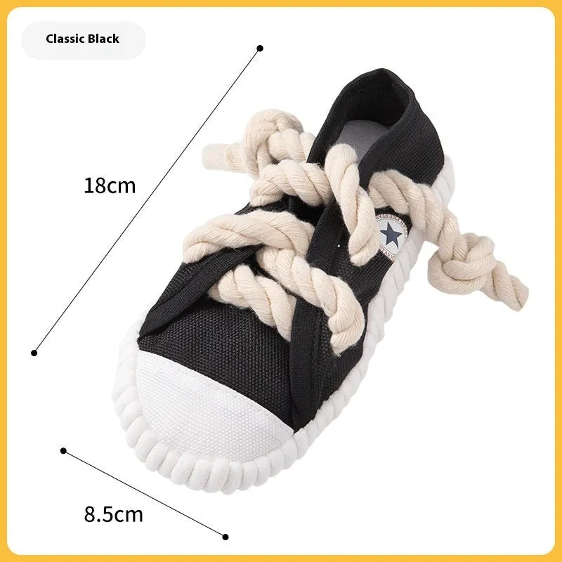 Slipper-shaped plastic dog chew toy with a squeaker, shown in yellow, black, and blue colour options.