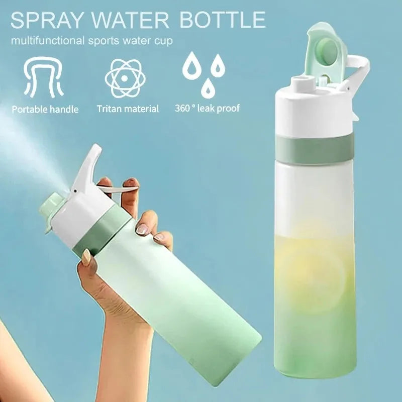 White 700ml plastic spray water bottle with handle strap and leakproof lid.
