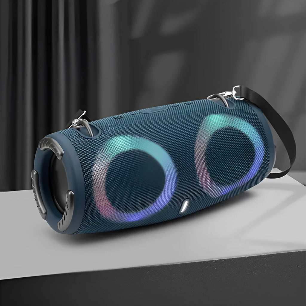 Cylindrical War Drum Bluetooth speaker with coloured RGB lights in a waterproof outdoor setting.