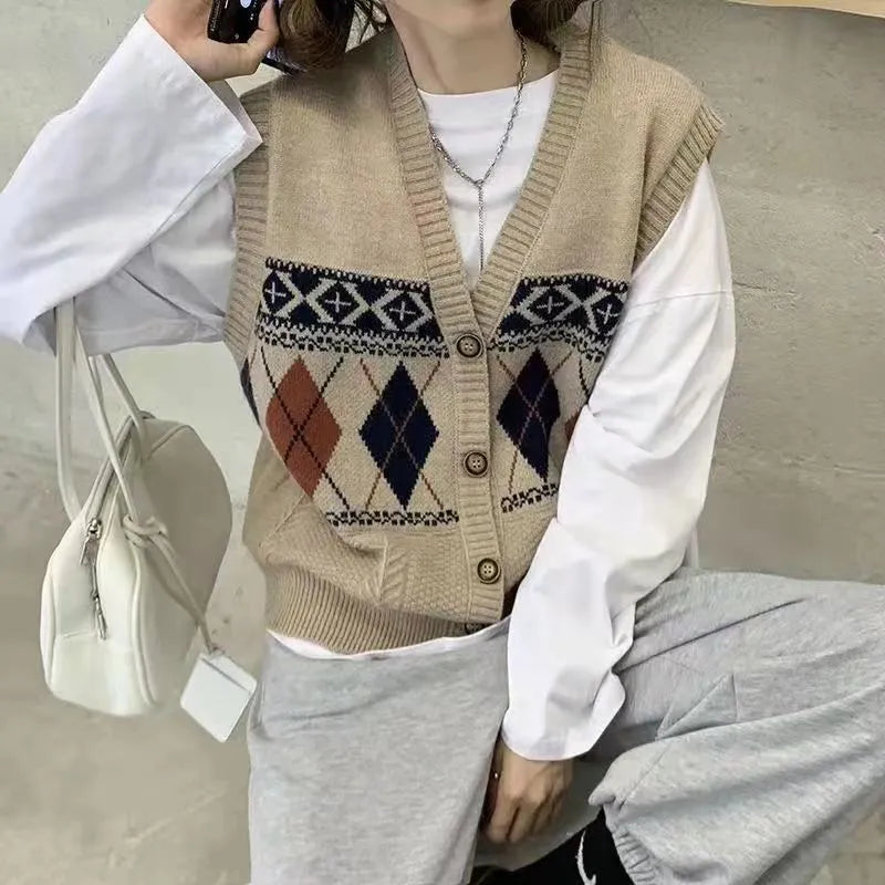 Khaki sleeveless loose cardigan top with diamond plaid pattern, open front.