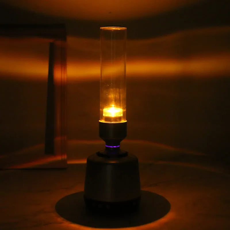 White silver candlelight Bluetooth speaker night light with modern design and push-button controls.