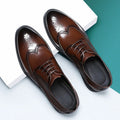 Men's black and brown brogue style shoes with a PU leather upper for business wear.