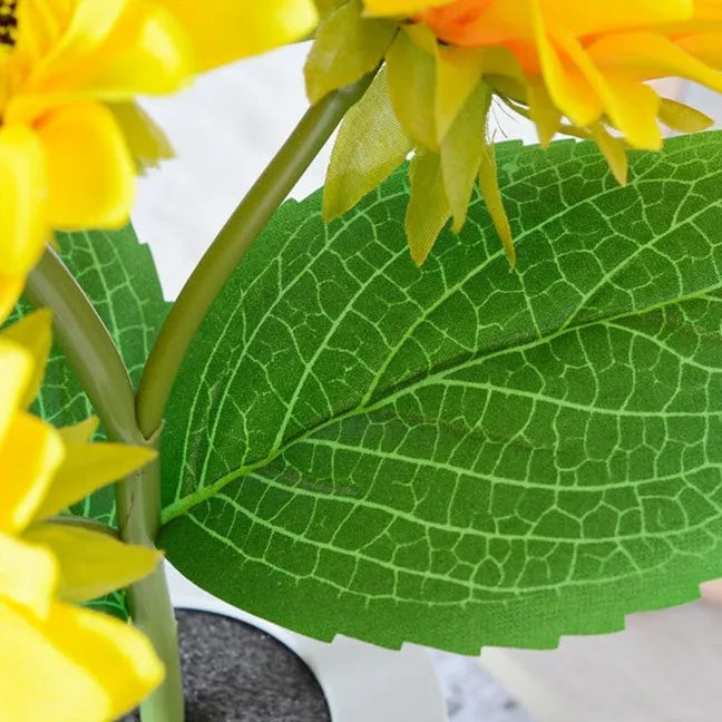Rechargeable artificial sunflower LED night light on table with USB cable