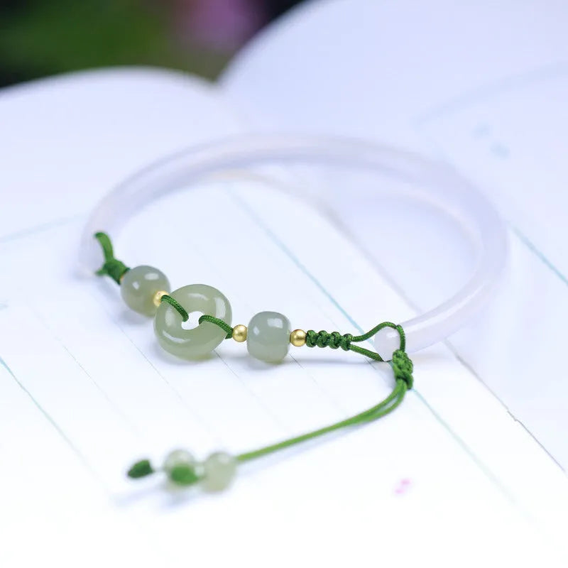 Handmade white agate half bracelet with peace buckle closure and hand-woven bead construction