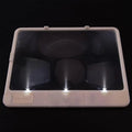 Black desktop magnifying glass with LED light showing large rectangular lens and PVC handle