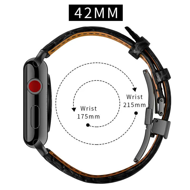 Genuine crocodile skin watch strap in brown with rose gold buckle, 42-44mm width, on a wooden surface