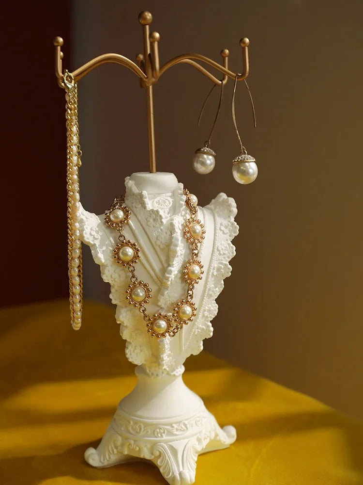 White plaster retro jewellery display stand with three layers, neutral background for necklace display