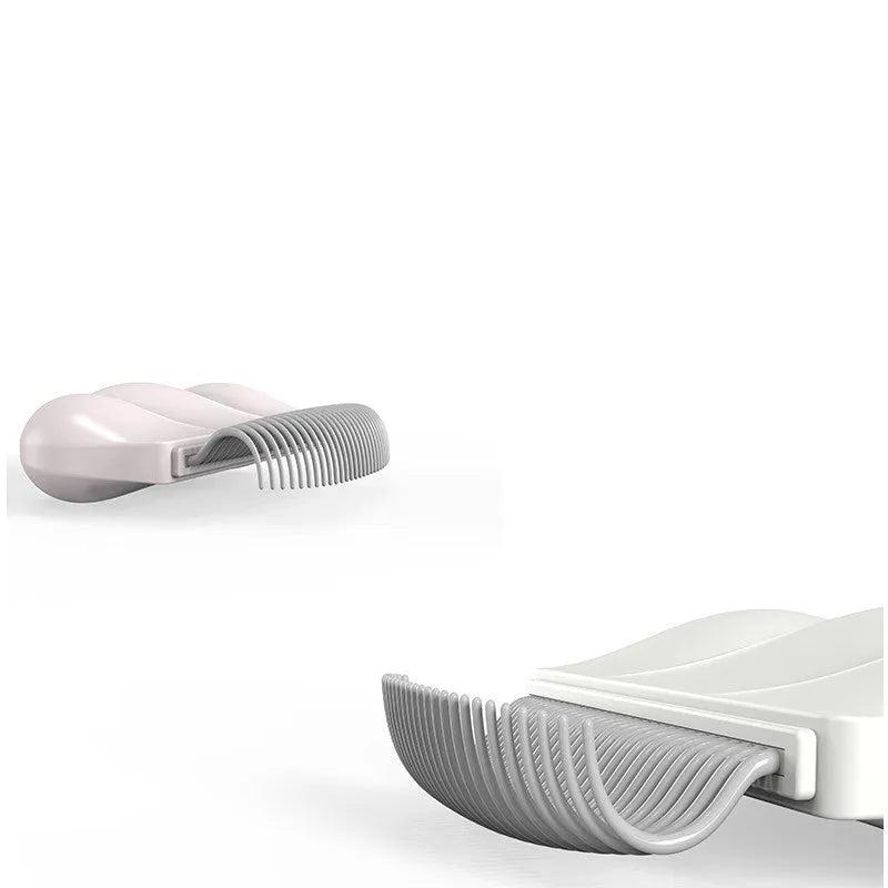 Paw Soft deshedding brush grooming tool for cats and dogs on white background
