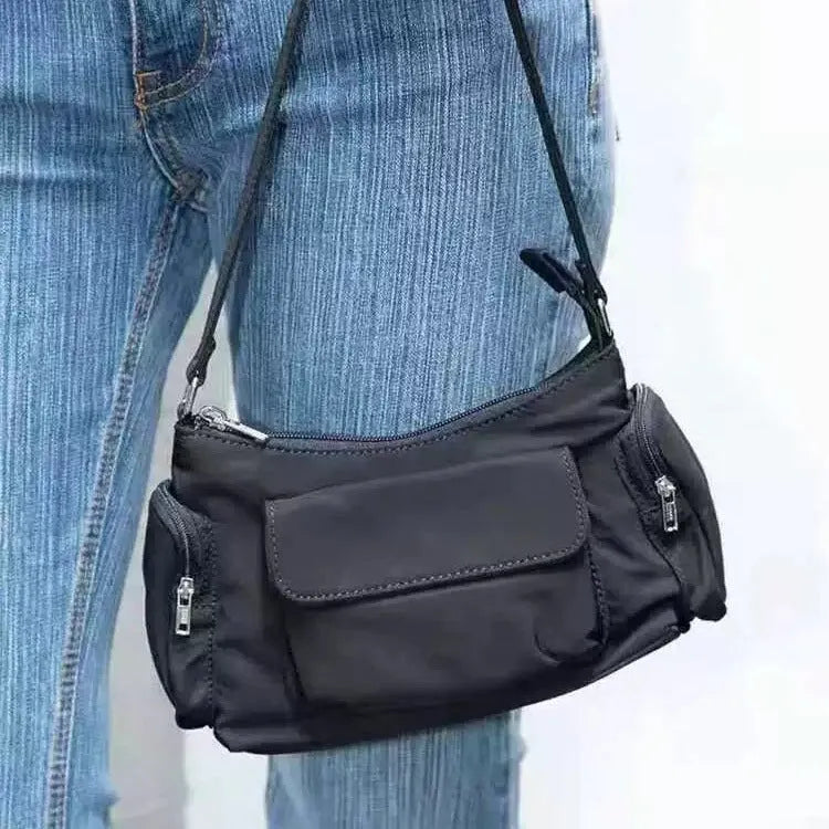 Black PU nylon women's shoulder bag with two pockets and side line detail showing dimensions