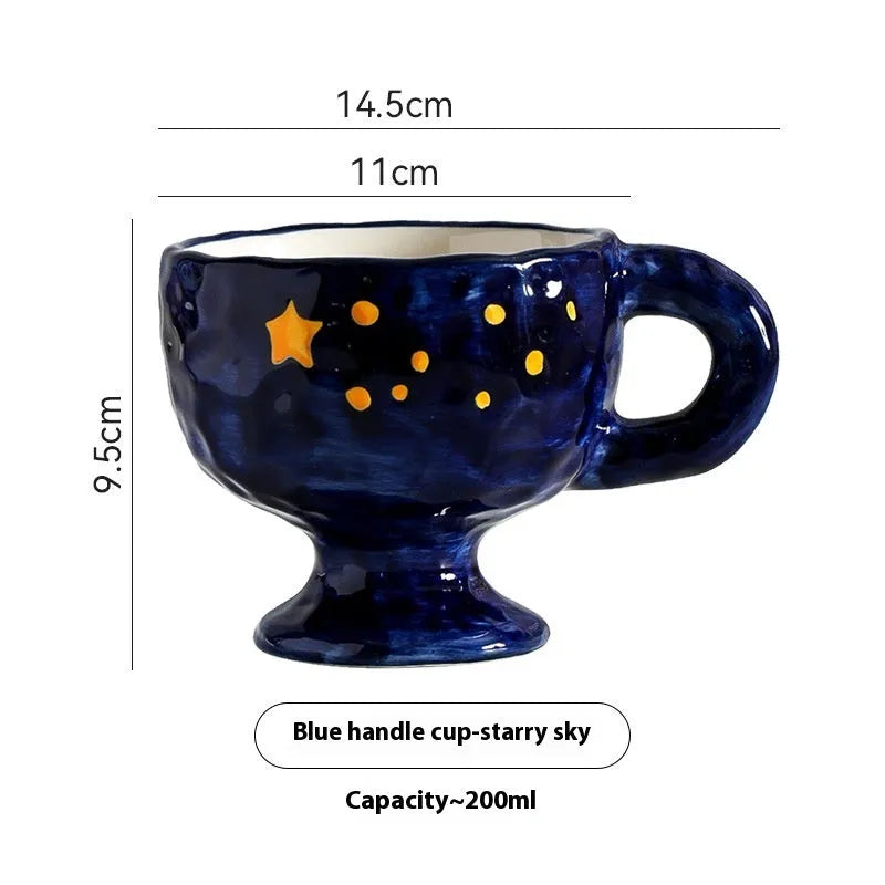 Irregularly shaped hand-pinched ceramic mug in a solid colour, shown on a plain background.