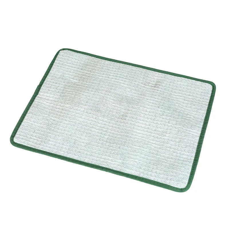 Green washable dog grass pee training mat with realistic lawn texture on a patio.