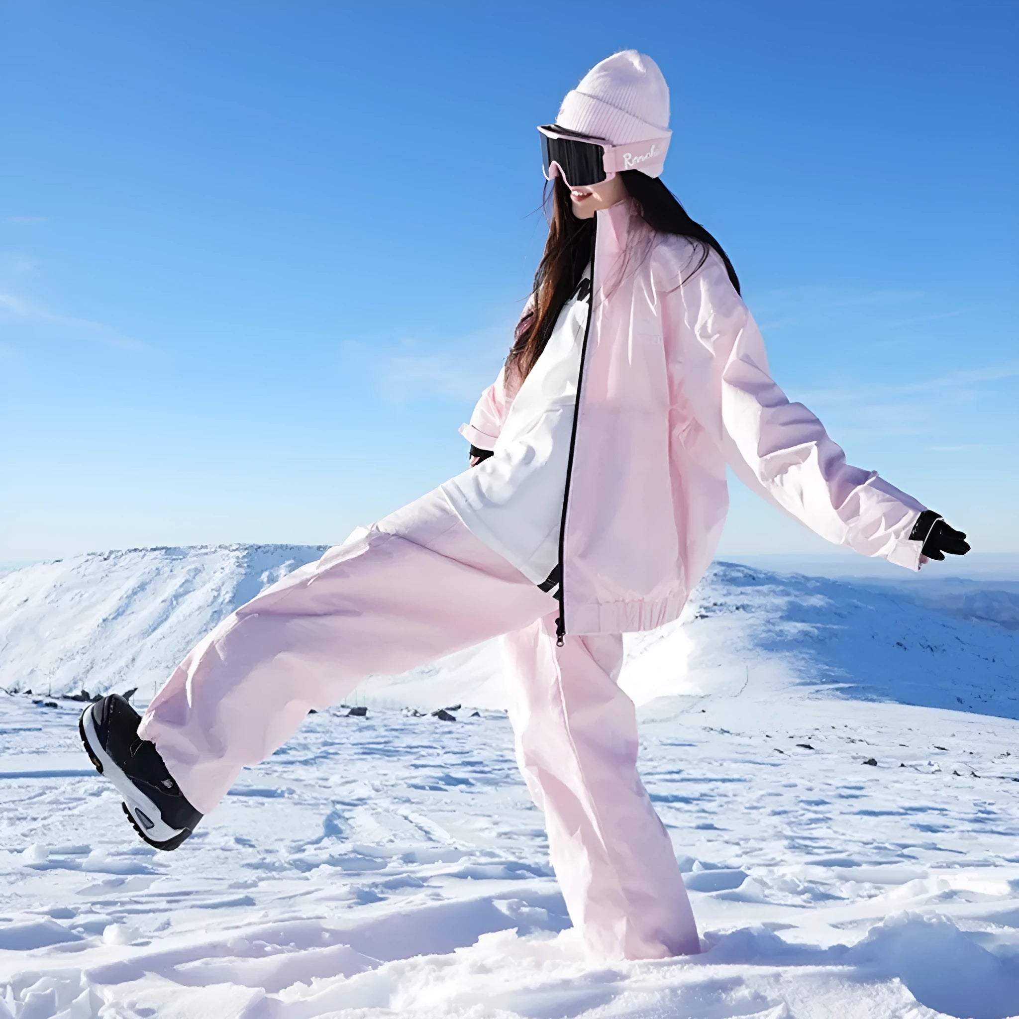 Pink and black waterproof cotton blend winter ski suit jacket and trousers set on hanger
