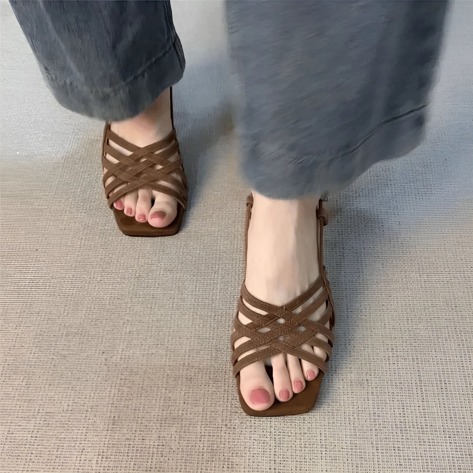 Women's light brown retro sandals with thin cross straps and an ankle buckle on a 3-6cm heel.