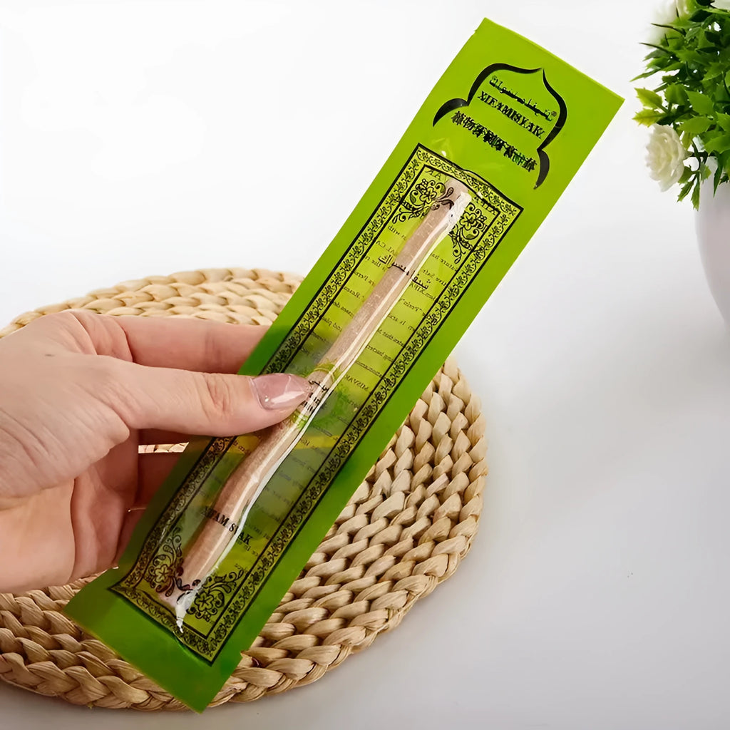 Wooden teeth cleaning stick on bathroom counter for adult oral hygiene