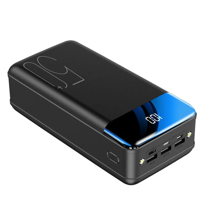 Black and white 50000mAh power bank showing three USB output ports and its large form factor.