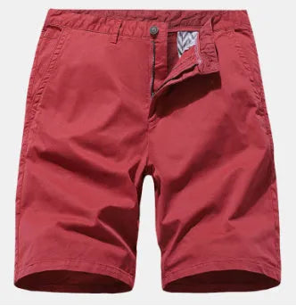 Man wearing blue printed denim casual shorts with a loose, straight leg fit and no belt.