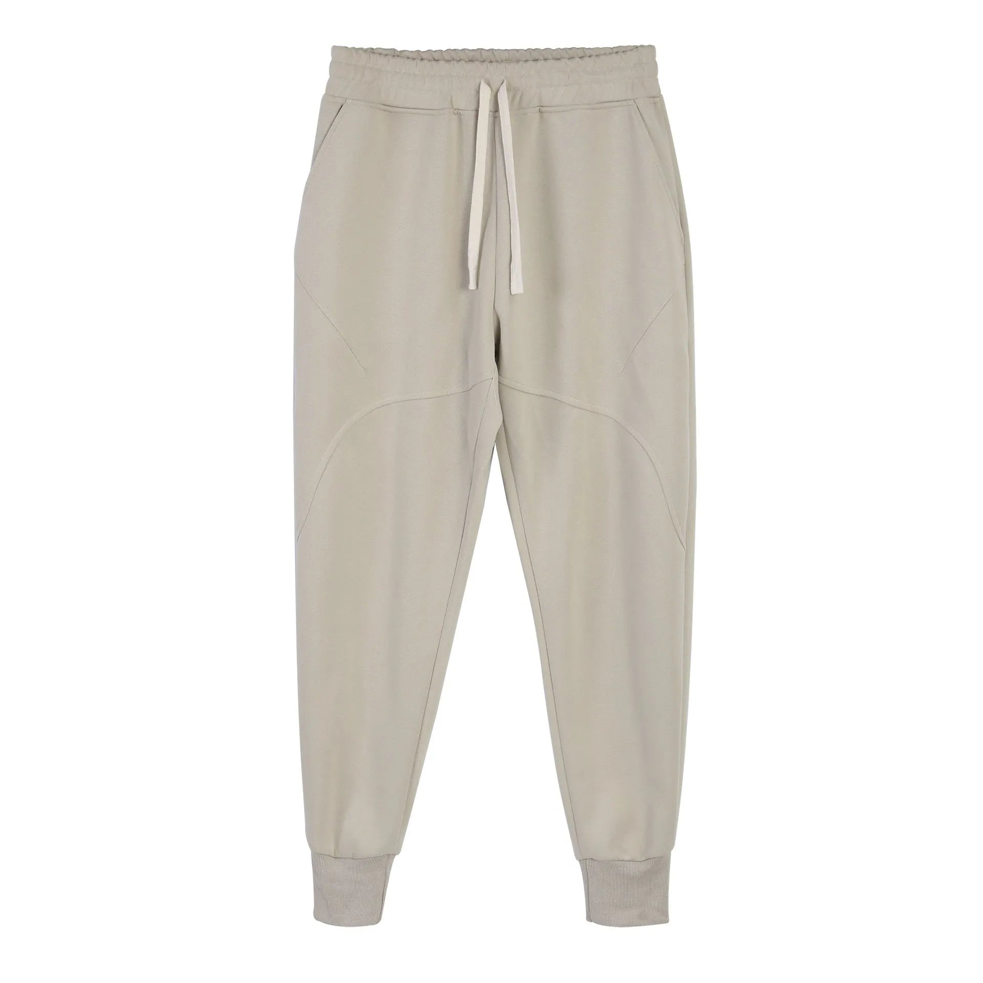 Man wearing grey ankle-tie drawstring sweatpants for casual leisure.