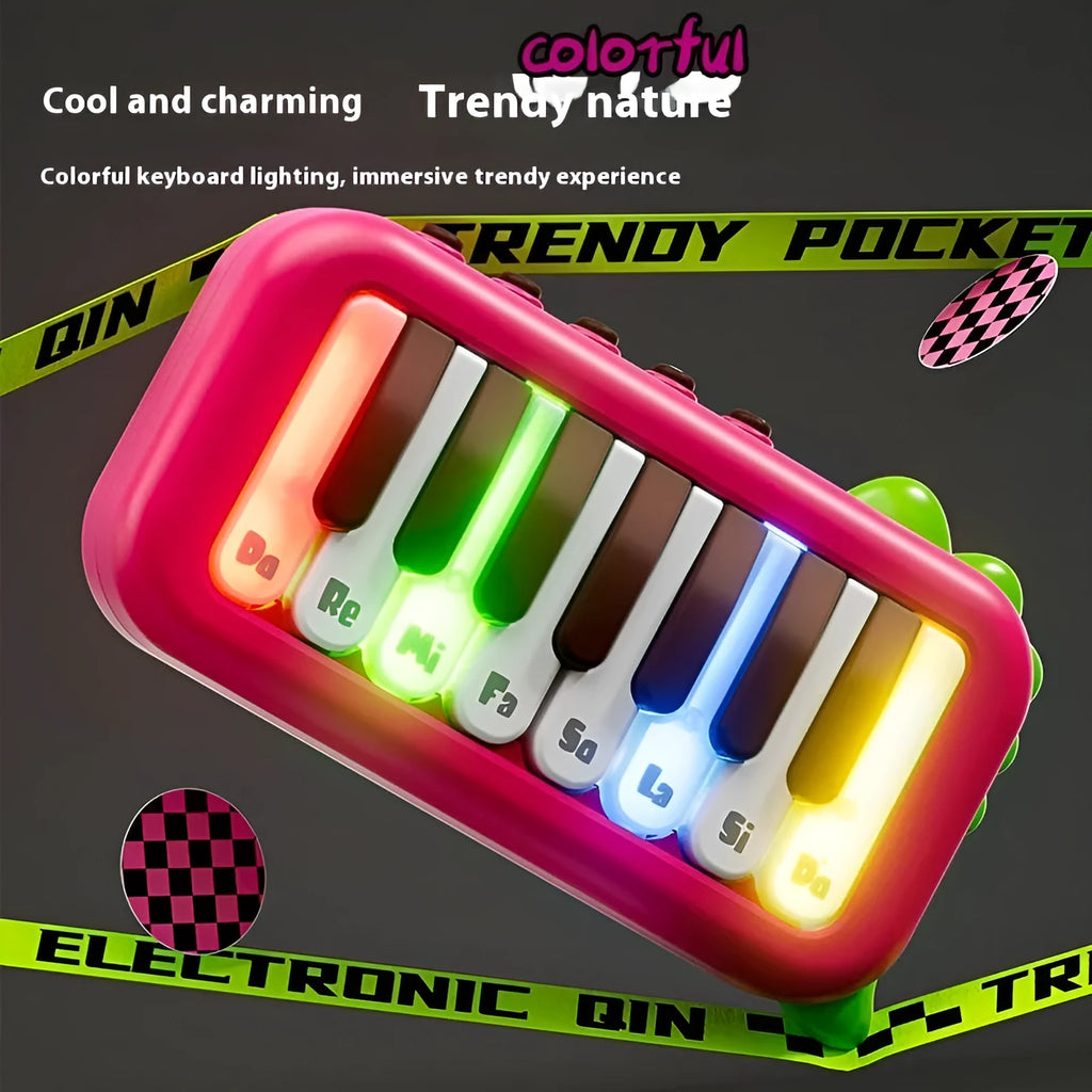 Baby pocket electronic keyboard toy in Little Piano Pattern design, shown in green and pink colour options.