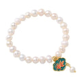 White freshwater pearl bracelet with goldfish pendant and water ripple design in vintage baroque style