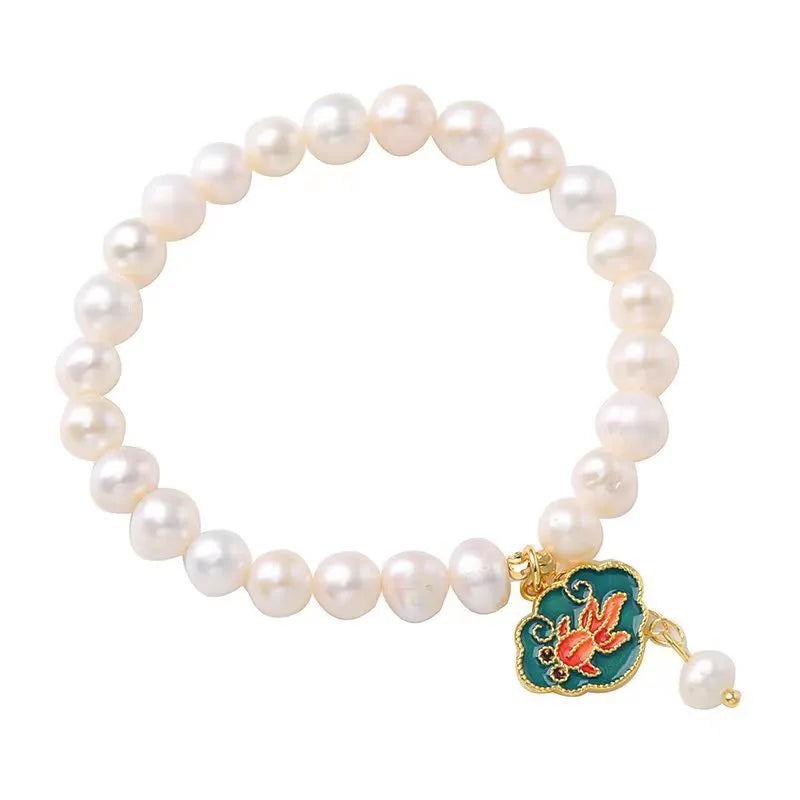 White freshwater pearl bracelet with goldfish pendant and water ripple design in vintage baroque style