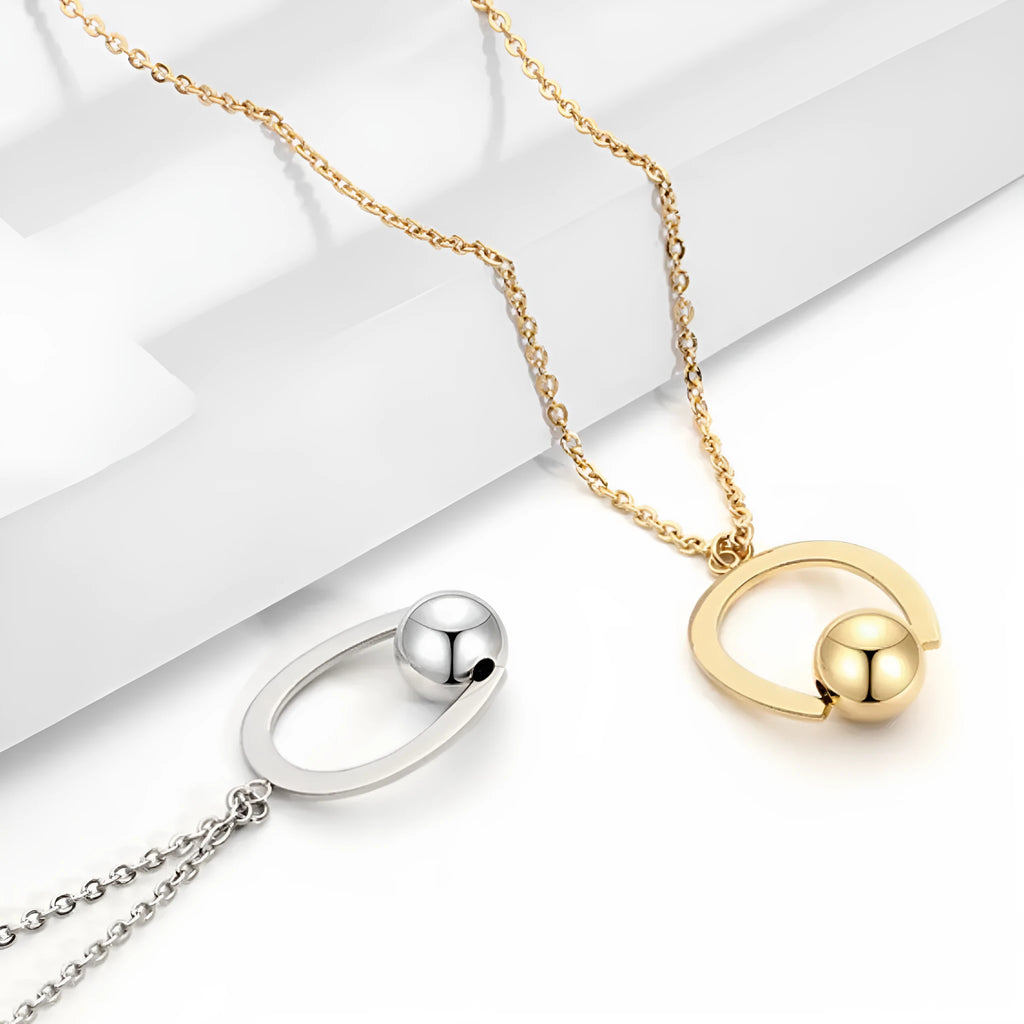 Adjustable stainless steel necklace with a geometric pendant on a cross chain in gold or silver.