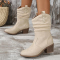 Women's suede mid-calf boots with a block heel and leather stitching details in lotus root colour.