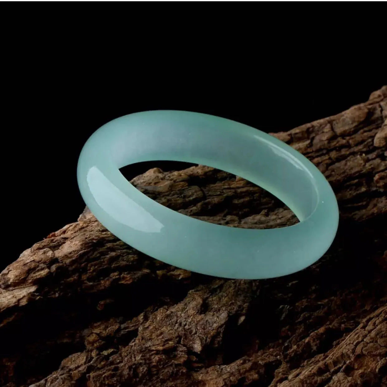 Oil cyan light green jade bracelet in modern simplicity style on wrist