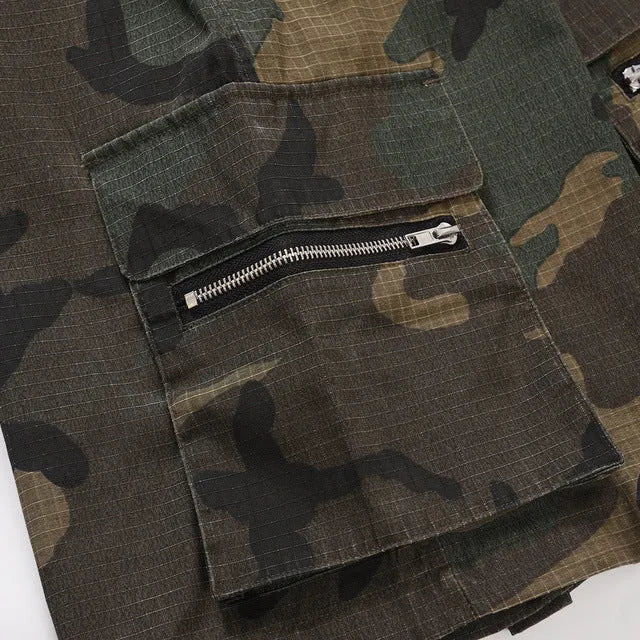 Green washed camouflage cotton cargo shorts with multiple pockets on a mannequin