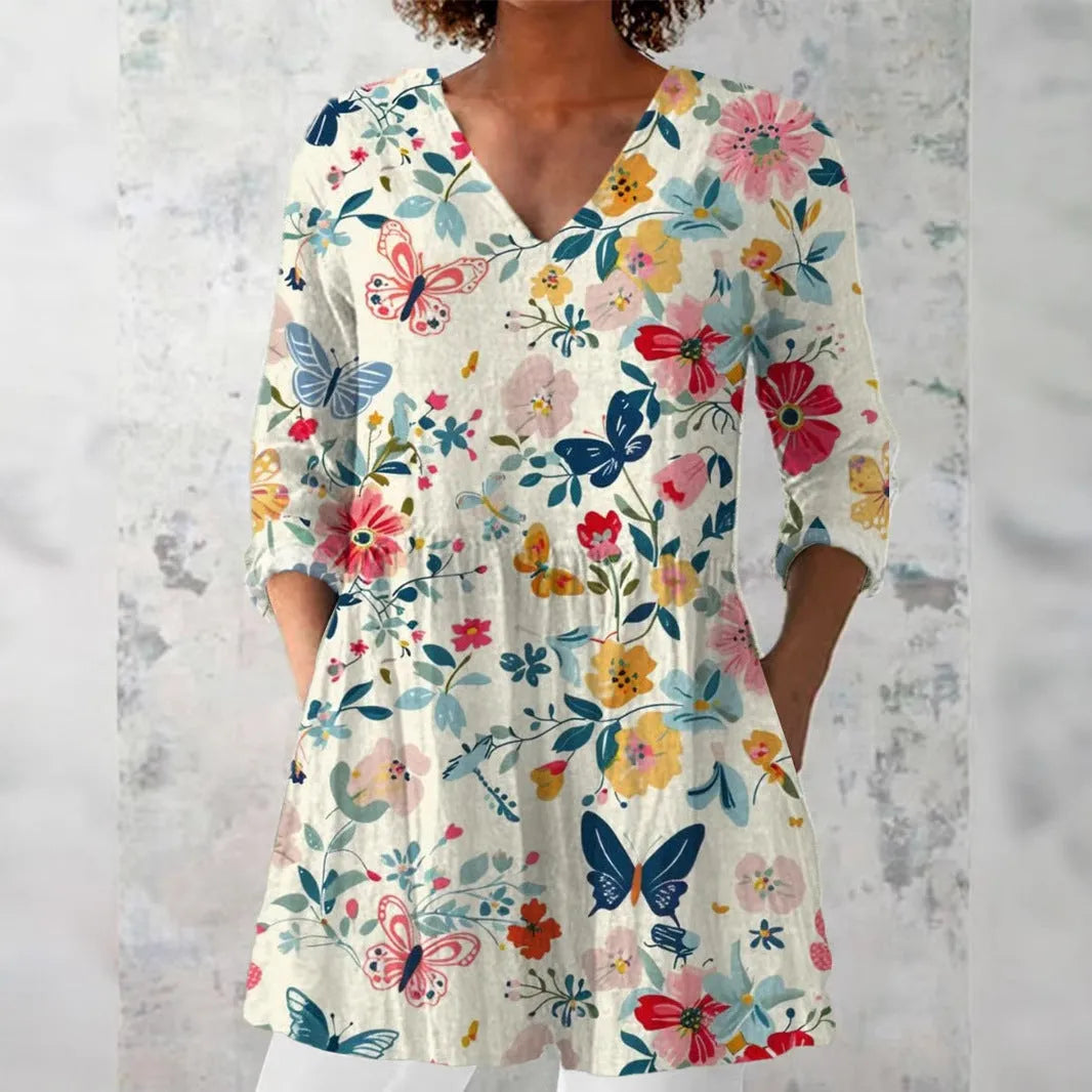 Women wearing a retro-style slim fit long-sleeved top with a digital print pattern.