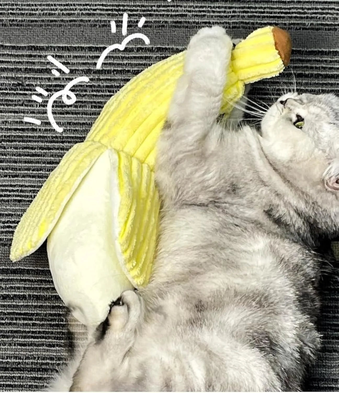Yellow banana-shaped plush cat toy with a green tip and a textured velvet strip.