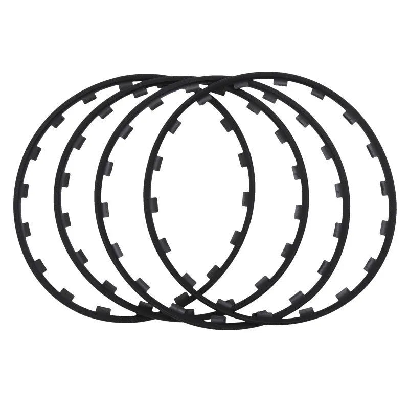 Set of four white nylon wheel hub protection rings for alloy wheels on a grey background.