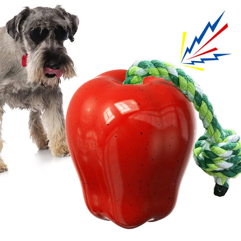 Green apple-shaped dog toy with a hole for food, acting as a dropping ball and molar chew.