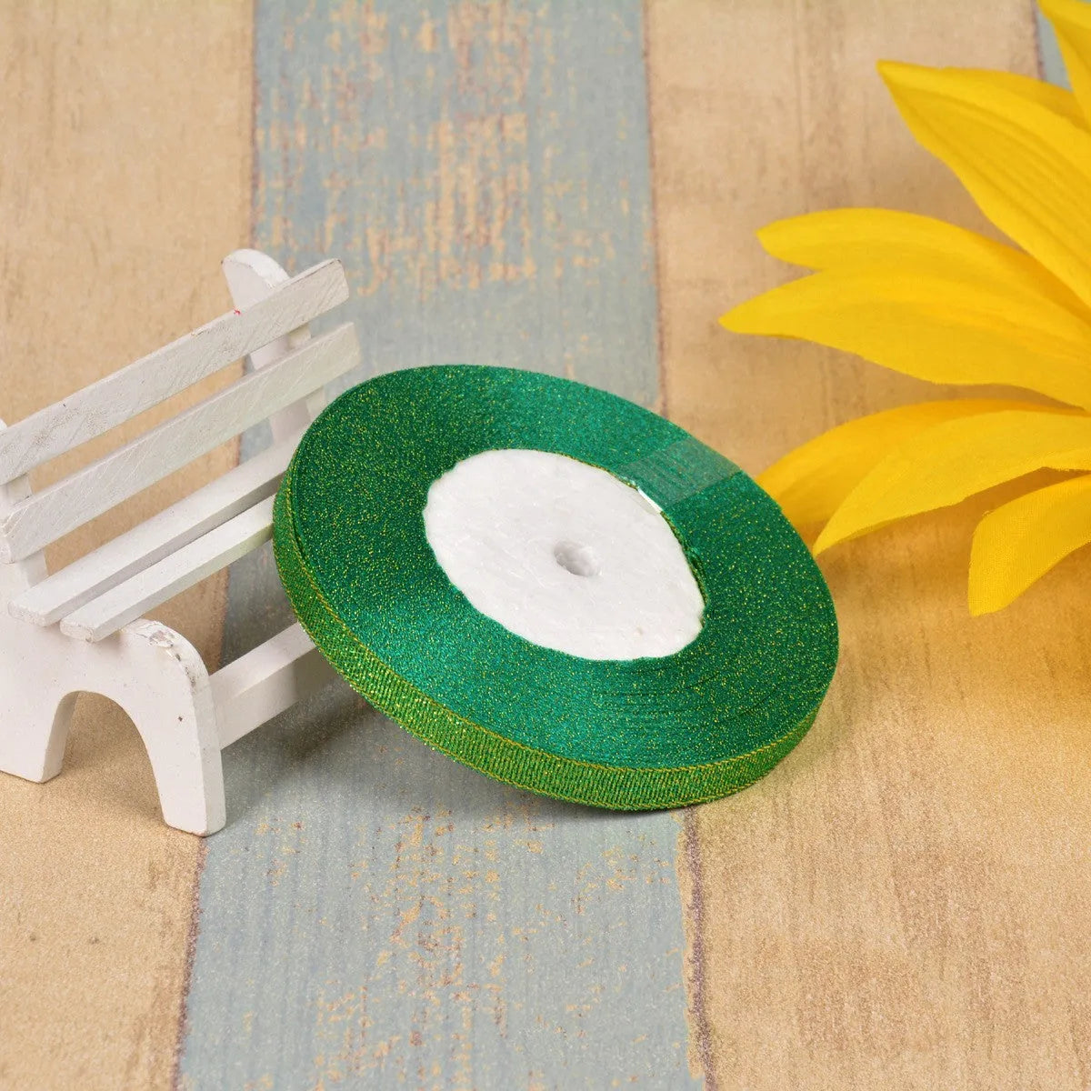 Colourful green onion pattern polyester ribbon spool with metallic gold or silver wire detailing.
