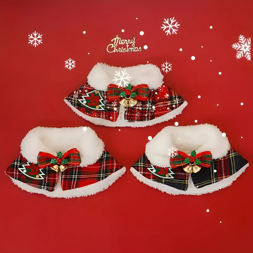 Red festive dog scarf with bell pattern fastened around a small dog's neck in winter.