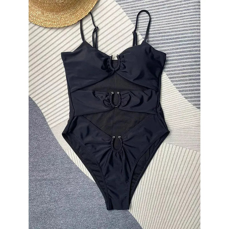 Black women's one-piece swimsuit on mannequin showing front design
