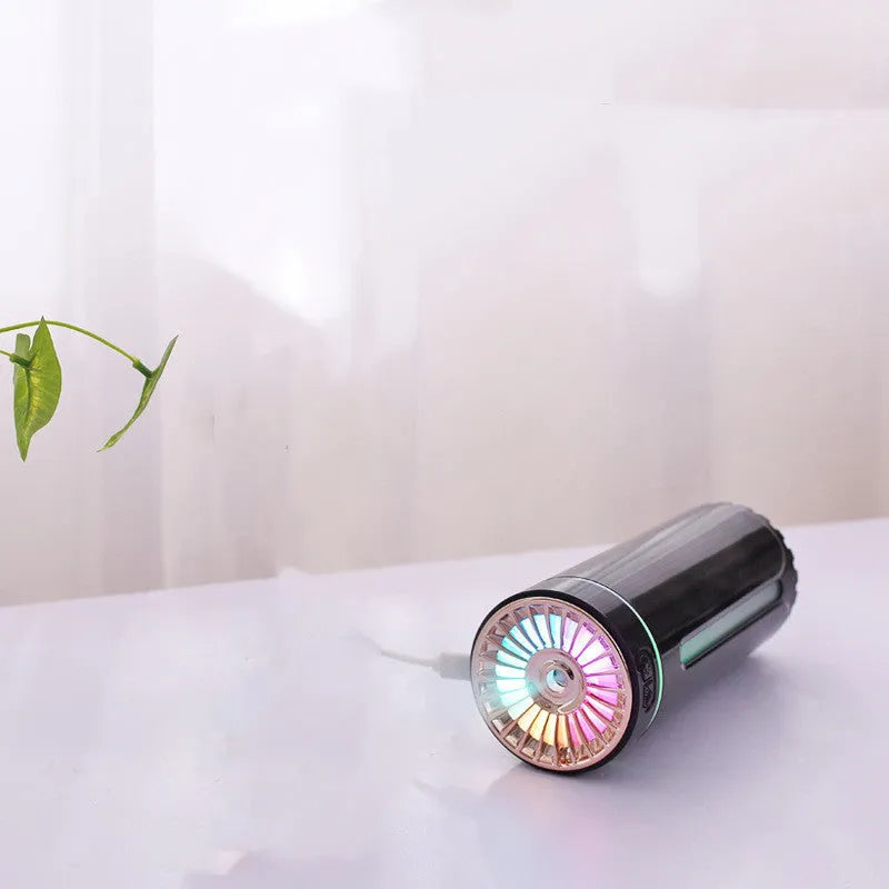 Black portable USB rechargeable humidifier with colourful LED lights on car cup holder
